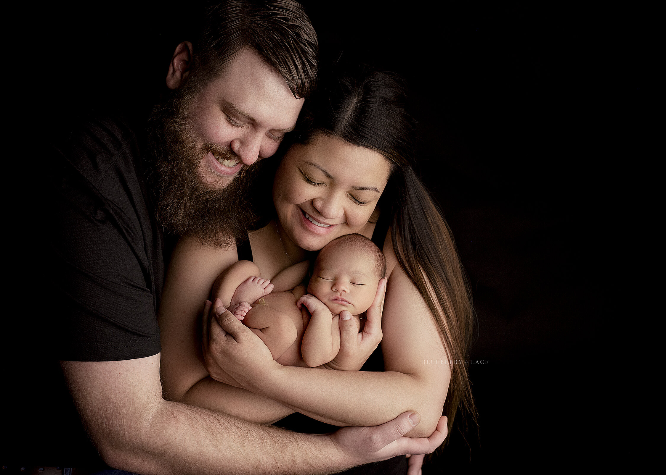 newborn baby family photo in Syracuse, black backdrop family photo