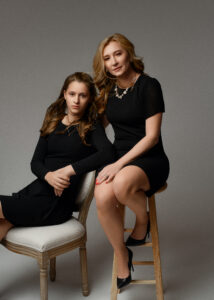 Mother daughter classic and elegant pose 